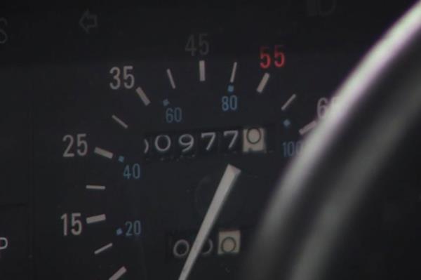A closeup of the odometer of a 1981 DeLorean found in barn, showing that it has just 977 miles on it.
