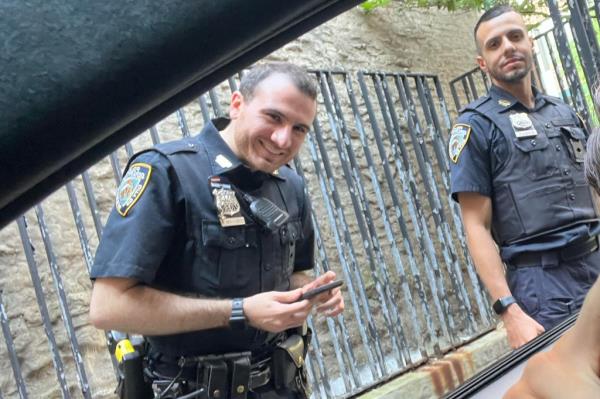 Police at the scene wher<em></em>e Joseph Sadykov's stolen BMW was recovered in the Bronx, taken at night from the front of the car