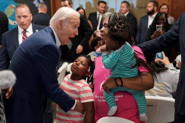 U.S. President Joe Biden greets Andrea Dyess and her family during an event held at a community center in Racine County, Wisconsin, U.S., May 8, 2024.