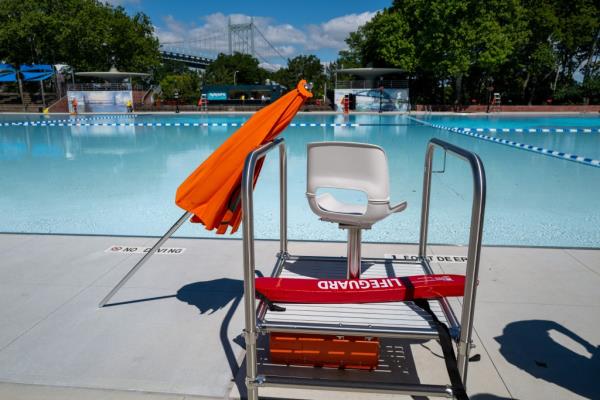 An empty lifeguard chair at a New York City pool.