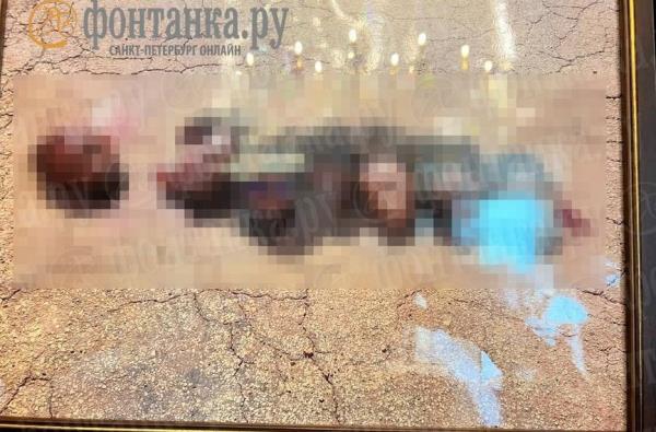 A f<em></em>ramed photo of severed heads was found during the raid, their identities unknown.