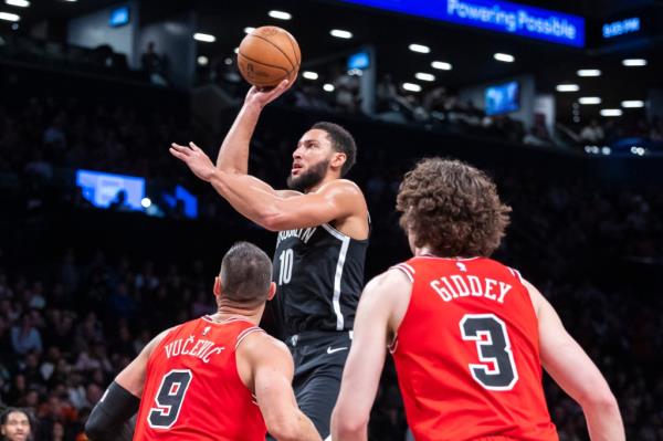 Brooklyn Nets guard Ben Simmons (10) shots over Chicago Bulls center Nikola Vucevic (9) and Chicago Bulls guard Josh Giddey (3) in the second half at Barclays Center, Friday, Nov. 1, 2024