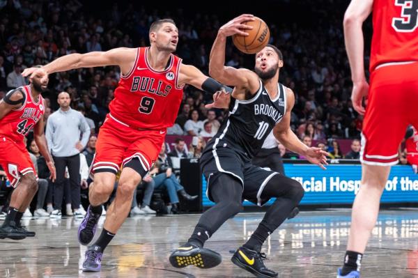 Brooklyn Nets guard Ben Simmons (10) is defended by Chicago Bulls center Nikola Vucevic (9) in the second half at Barclays Center, Friday, Nov. 1, 2024, in Brooklyn, NY. 