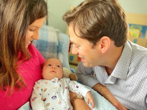 Elise Stefanik and her husband Matt Manda holding a baby