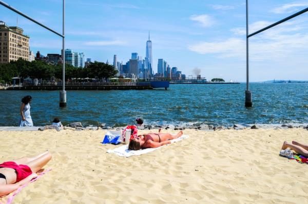 A woman lies on the beach