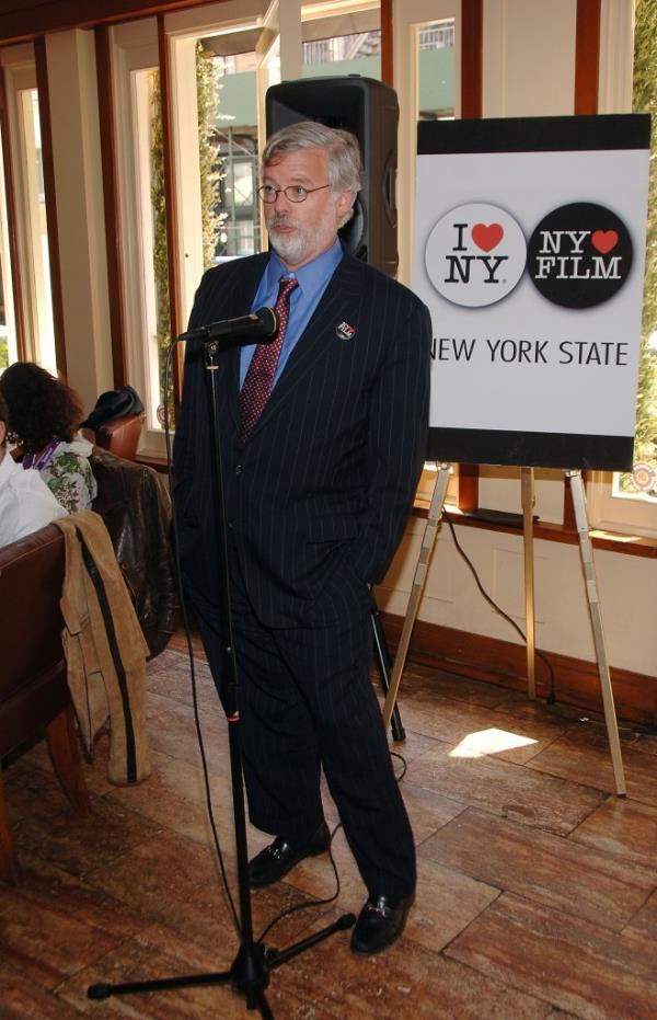 Pat Foye standing at a microphone