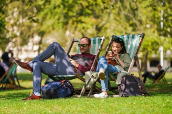 Mandatory Credit: Photo by Amer Ghazzal/Shutterstock (14127361b) People relaxing in the autumn sunshine in Saint Jame Park south west Lo<em></em>ndon on a warm day in Lo<em></em>ndon as temperatures reach 22C before the arrival of strom Agnes which is set to hit the UK mainland with heavy rain and strong winds Seaso<em></em>nal Weather, Saint James Park, London, United Kingdom - 26 Sep 2023