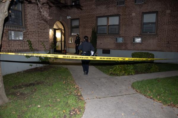 Police outside shooting scene at Flatbush Gardens. 