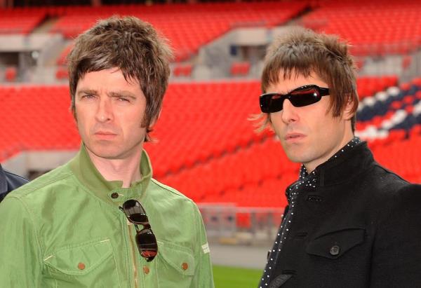 Noel Gallagher (left) and Liam Gallagher of Oasis pose at Wembley Stadium on October 16, 2008 in London, England. 