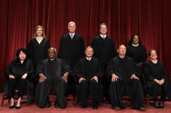 United States Supreme Court (front row L-R) Associate Justice So<em></em>nia Sotomayor, Associate Justice Clarence Thomas, Chief Justice of the United States John Roberts, Associate Justice Samuel Alito, and Associate Justice Elena Kagan, (back row L-R) Associate Justice Amy Co<em></em>ney Barrett, Associate Justice Neil Gorsuch, Associate Justice Brett Kavanaugh and Associate Justice Ketanji Brown Jackson pose for their official portrait at the East Co<em></em>nference Room of the Supreme Court building on October 7, 2022 in Washington, DC. 