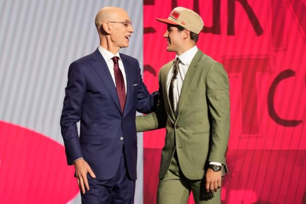 Reed Sheppard (right) greets NBA Commissio<em></em>ner Adam Silver after being selected by the Rockets No. 3 overall in the 2024 NBA Draft.