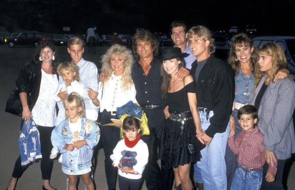 Actor Michael Landon, Jr. and family members posing together at the Third Annual Moo<em></em>nlight Roundup Benefit, Calamigos Ranch, Malibu, California, 1989.