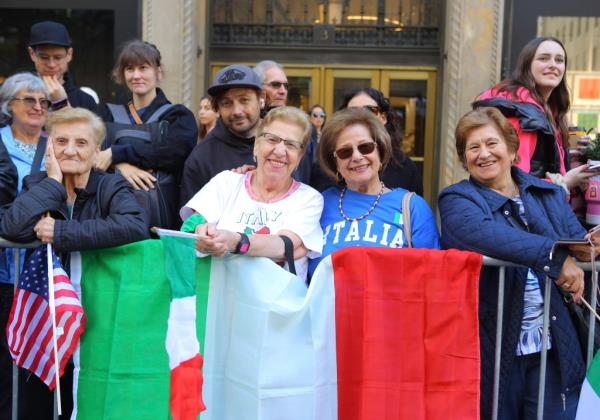 Women hold an Italian flag at the Columbus Day Parade in Manhattan.