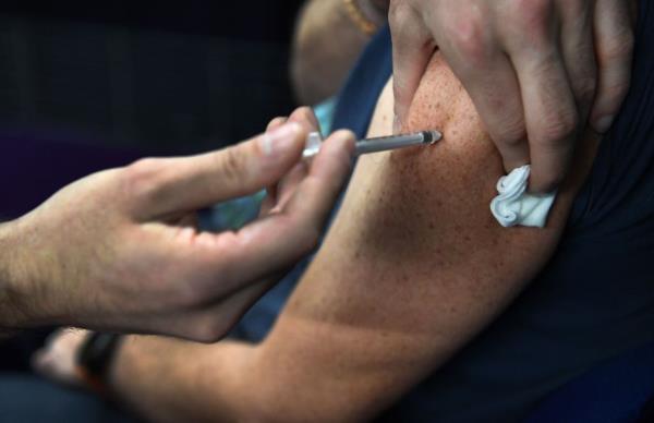 A flu vaccination and the updated COVID-19 shot are urged for just a<em></em>bout everyone.</p>

<p>　　