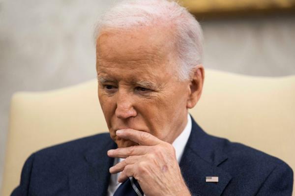 U.S. President Joe Biden in a meeting with Cyprus President Nikos Christodoulides in the Oval Office, making a reaction with hand to his mouth, October 30, 2024.