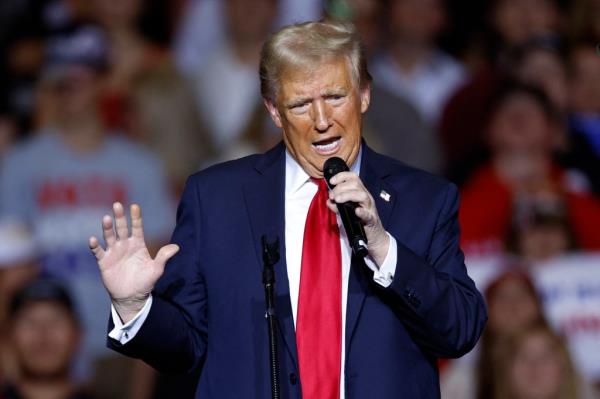 Former US President and Republican presidential candidate Do<em></em>nald Trump gestures as he speaks at a campaign rally at the Fiserv Forum in Milwaukee, Wisconsin, November 1, 2024.