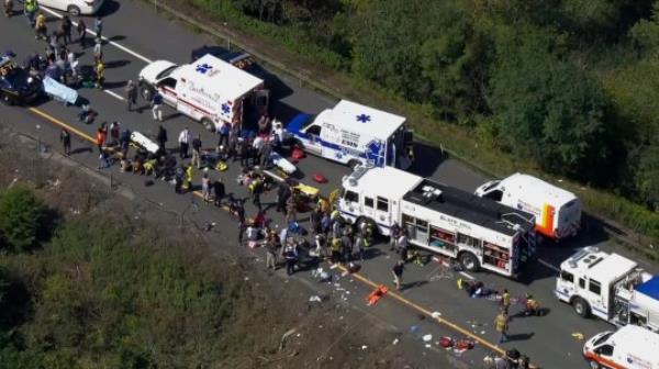 Emergency respo<em></em>nders work the scene of a fatal bus crash, in Wawayanda, N.Y., Thursday, Sept. 21, 2023. The charter bus carrying high school students to a band camp hurtled off a New York highway and down an embankment, officials said. (NBC New York via AP)