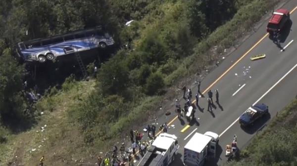 Emergency respo<em></em>nders work the scene of a fatal bus crash, in Wawayanda, N.Y., Thursday, Sept. 21, 2023. The charter bus carrying high school students to a band camp hurtled off a New York highway and down an embankment, officials said. (NBC New York via AP)
