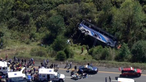 Emergency respo<em></em>nders work the scene of a fatal bus crash, in Wawayanda, N.Y., Thursday, Sept. 21, 2023. The charter bus carrying high school students to a band camp hurtled off a New York highway and down an embankment, officials said. (NBC New York via AP)