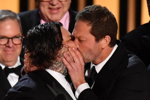 Ebon Moss-Bachrach kissing Matty Matheson. 