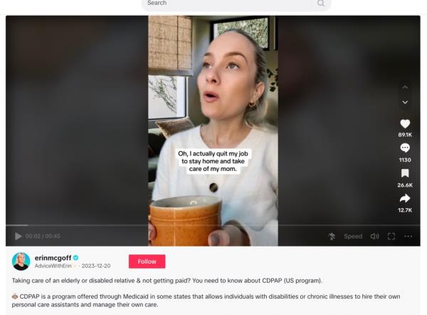 A screenshot of Erin McGoff holding a cup.