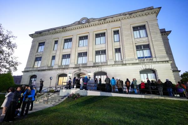 Spectators line up to enter the Carroll County Courthouse for the trail of Richard Allen, accused of the slayings of two teenage girls in 2017, is set to begin in Delphi, Ind., Friday, Oct. 18, 2024. 