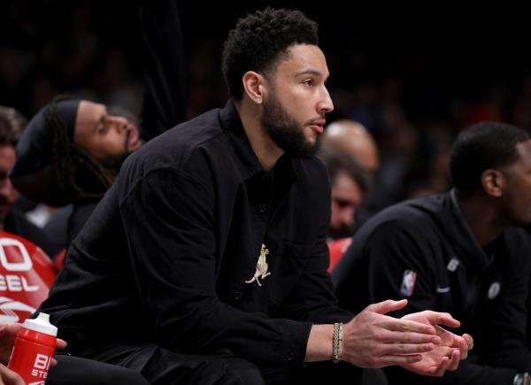 Ben Simmons #10 of the Brooklyn Nets looks on from the bench