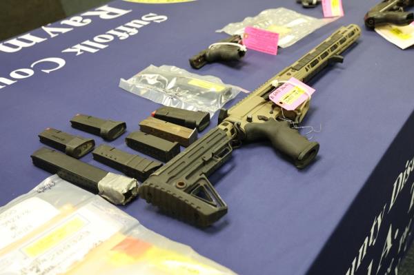 An assault rifle on the evidence table. 