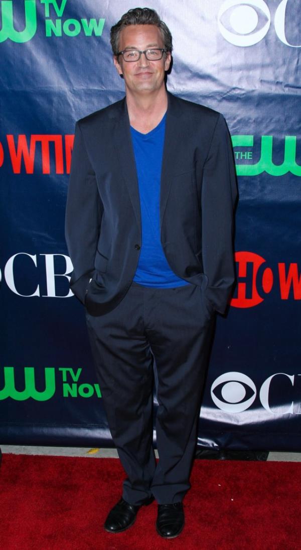 Matthew Perry smiles on the red carpet