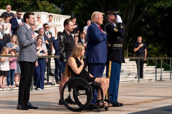 Former President Do<em></em>nald Trump and veterans Marlon Bateman, Tyler Vargas, and Kelsee Lainhart placing a wreath at the Tomb of the Unknown Soldier in ho<em></em>nor of fallen service members.