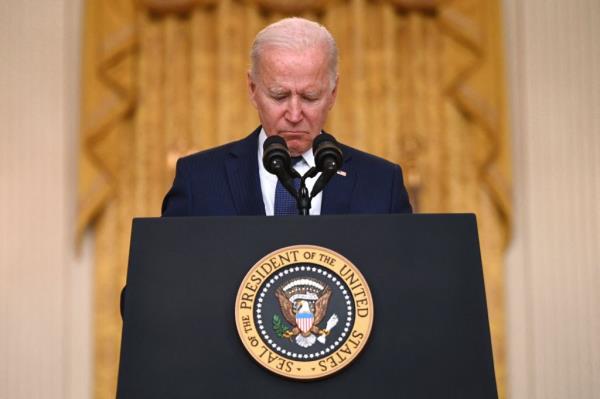 President Joe Biden pauses as he delivers remarks on the terror attack at Hamid Karzai Internatio<em></em>nal Airport, and the US service members and Afghan victims killed and wounded, in the East Room of the White House, Washington, DC on August 26, 2021.