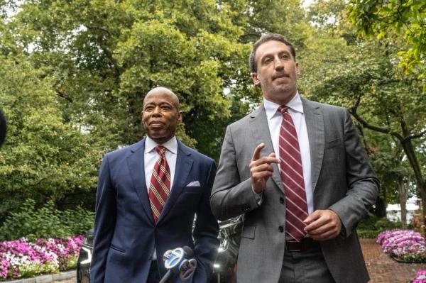 New York City Mayor Eric Adams stands with his lawyer Alex Spiro (R) who delivered remarks to the press on September 26, 2024 in New York City. Adams has been charged with five offenses: co<em></em>nspiracy to commit wire fraud, federal program bribery, solicitation of a co<em></em>ntribution by a foreign national, wire fraud, and bribery.