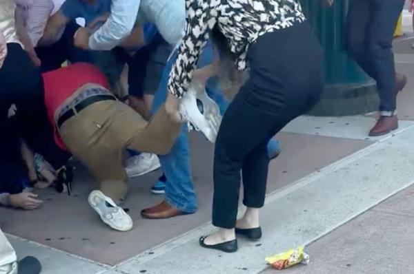 A distressed Jewish family at a Brooklyn elementary school graduation being verbally attacked by another family