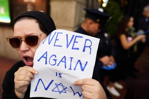 A woman holds a pro-Israel sign during a rally outside Columbia University on Thursday.