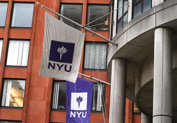 NYU campus with flag flying outside a building