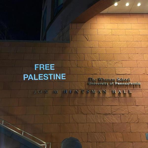 Free Palestine projected on a Wharton School building