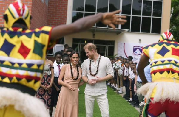 Prince Harry and Meghan, Duchess of Sussex, visit Lights Academy and interact with children in Abuja, Nigeria, promoting Invictus Games