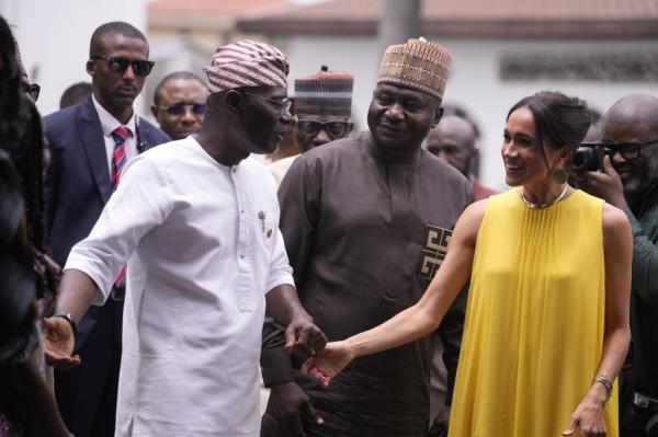 Meghan, the Duchess of Sussex, sitting beside Ngozi Okonjo-Iweala, Director-General of the World Trade Organization, at an event in Abuja, Nigeria