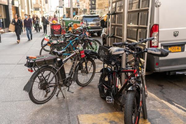 delivery drivers' e-bikes parked on the street