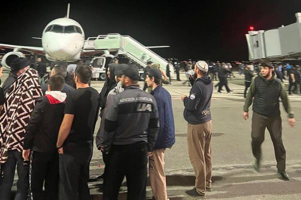People in the crowd shout antisemitic slogans at an airfield of the airport in Makhachkala, Russia, on Oct. 30, 2023. 