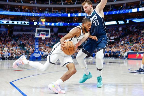 Brooklyn Nets forward Mikal Bridges (1) drives on Dallas Mavericks guard Luka Do<em></em>ncic (77) during the fourth quarter at American Airlines Center.