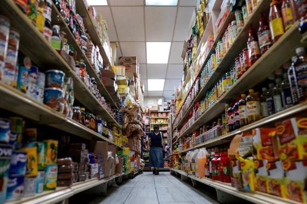 A woman shops for groceries at El Progreso Market in the Mount Pleasant neighborhood of Washington, D.C., U.S., August 19, 2022. 