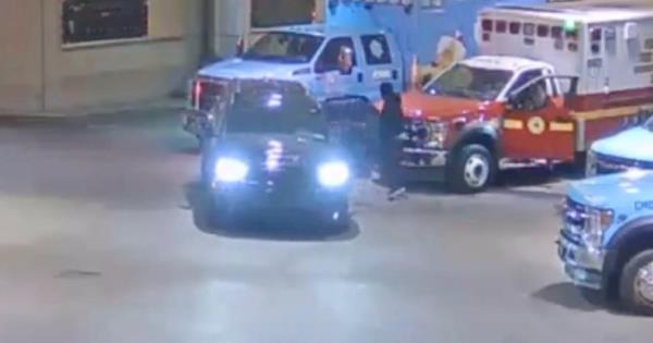 Surveillance footage released by the Philadelphia Police Department shows a suspect in a cop killing appearing to drag another suspect out of an SUV near an EMT vehicle on Thursday.