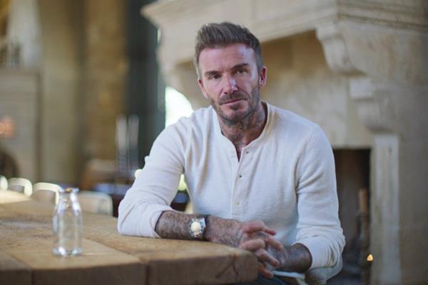David Beckham sitting at a table during an interview in the Beckham docu<em></em>mentary