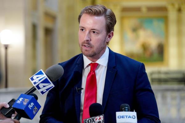 State schools Superintendent Ryan Walters speaking into micropho<em></em>nes at a press co<em></em>nference in Oklahoma Capitol, discussing education spending practices