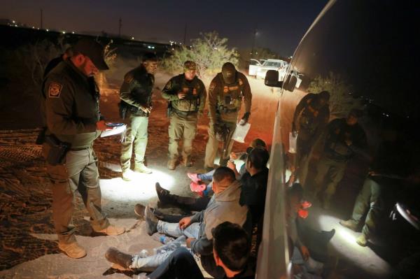 Border Patrol agents detaining migrants in Sunland Park, New Mexico on Oct. 24, 2024.