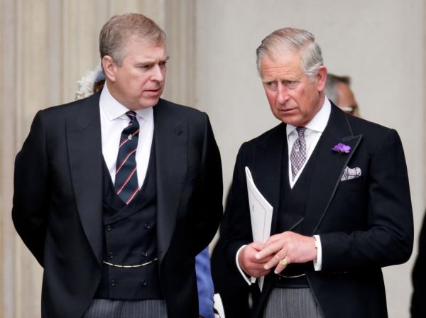 Prince Charles and Prince Andrew in suits attending Queen Elizabeth II's Diamond Jubilee service at St. Paul's Cathedral in London, 2012