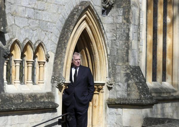 Prince Andrew, Duke of York, standing in a doorway at the Royal Chapel of All Saints at Royal Lodge, Windsor