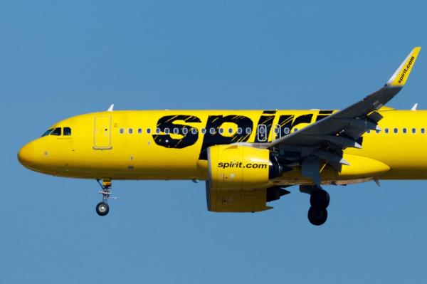 Yellow Spirit commercial airliner preparing to land at San Diego Internatio<em></em>nal Airport.