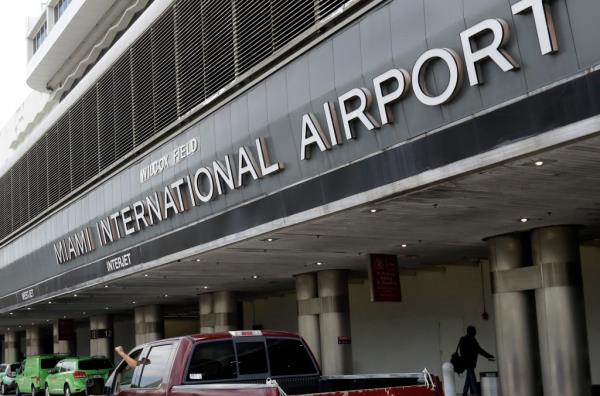 The pair was escorted off a Las Vegas-bound plane in handcuffs at Miami Internatio<em></em>nal Airport by police officers after crew members grew co<em></em>ncerned a<em></em>bout the potential bio-hazard